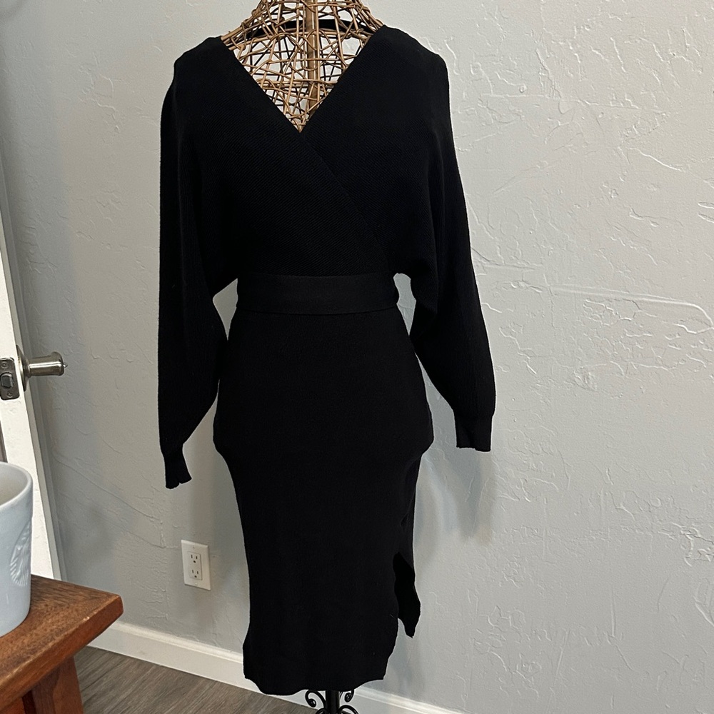 Elegant Black knit dress with deep v neck front and back. Size M. Midi.